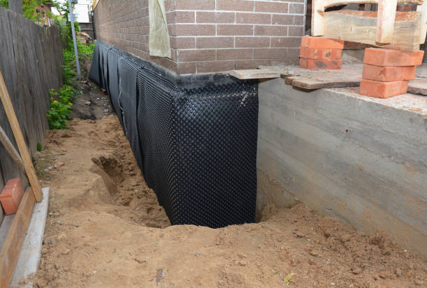 Happy homeowners after waterproofing job in Towaco